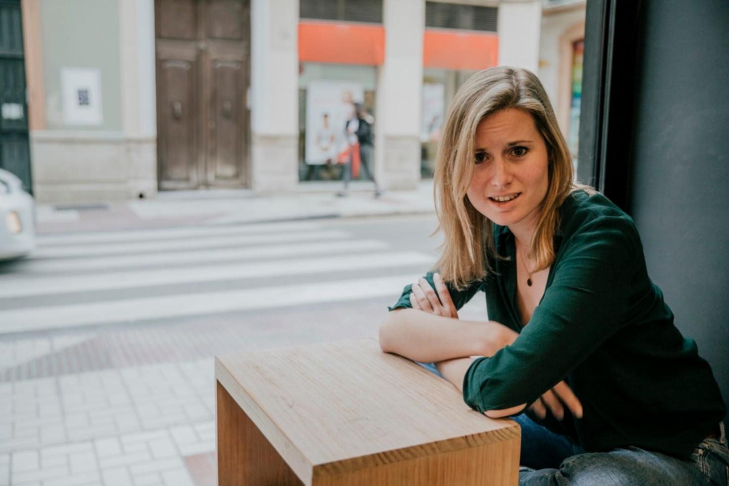 Investment analysis workspace showing financial charts and market data on computer screens